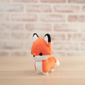 mini orange and white stuffed fox standing