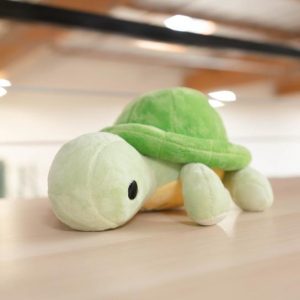 torti the green tortoise plush on table