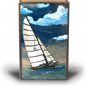 front of tack with blue skies and sail boat