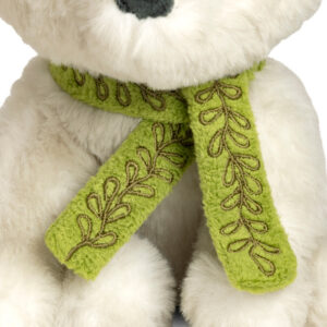 close up of white arctic fox with green scarf