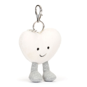 front of amuseables cream heart bag charm with face