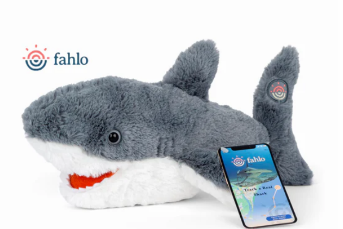 grey and white shark with red mouth stuffed animal