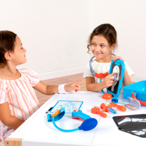 two girls playing with doctor set