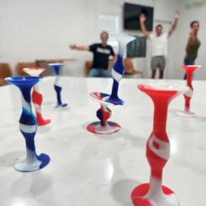 red white and blue popdarts with people cheering in the background