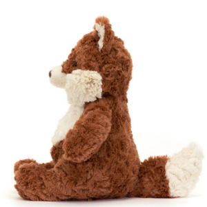 side view of mortimer fox stuffed animal by jellycat with rust colored fur and cream cheeks, tail and belly