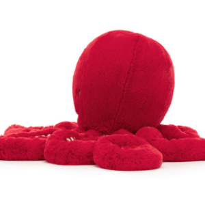 SIDE VIEW OF A RED OCTOPUS PLUSH