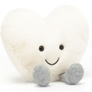 cream colored plush heart with face and legs