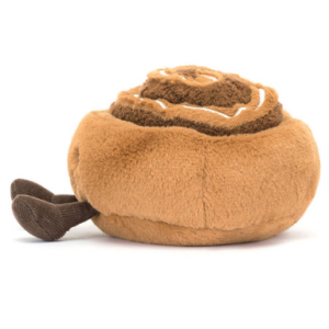 side view of brown cinnamon roll plush from jellycat