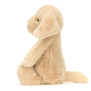 side view of tan colored puppy dog plush
