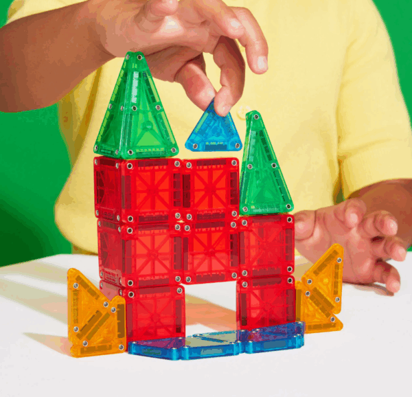 kid playing with micromags set