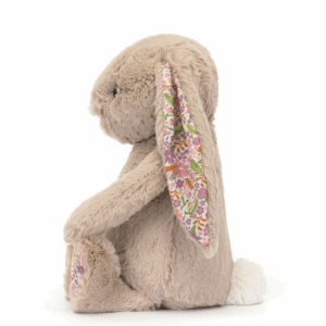 side view of beige plush bunny