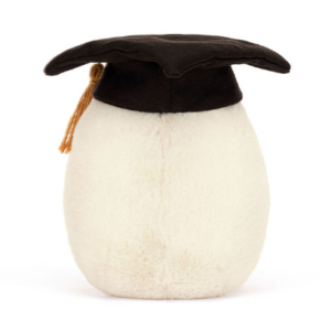 back side of side view of boiled egg plush with black graduation cap