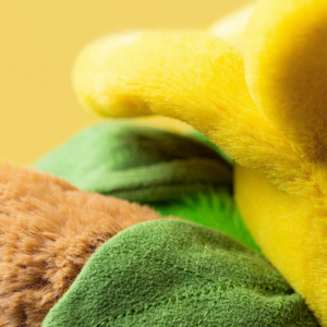 close up of yellow, brown & green plush