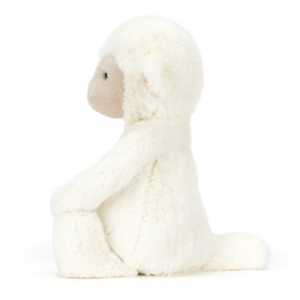 side view of cream colored plush lamb